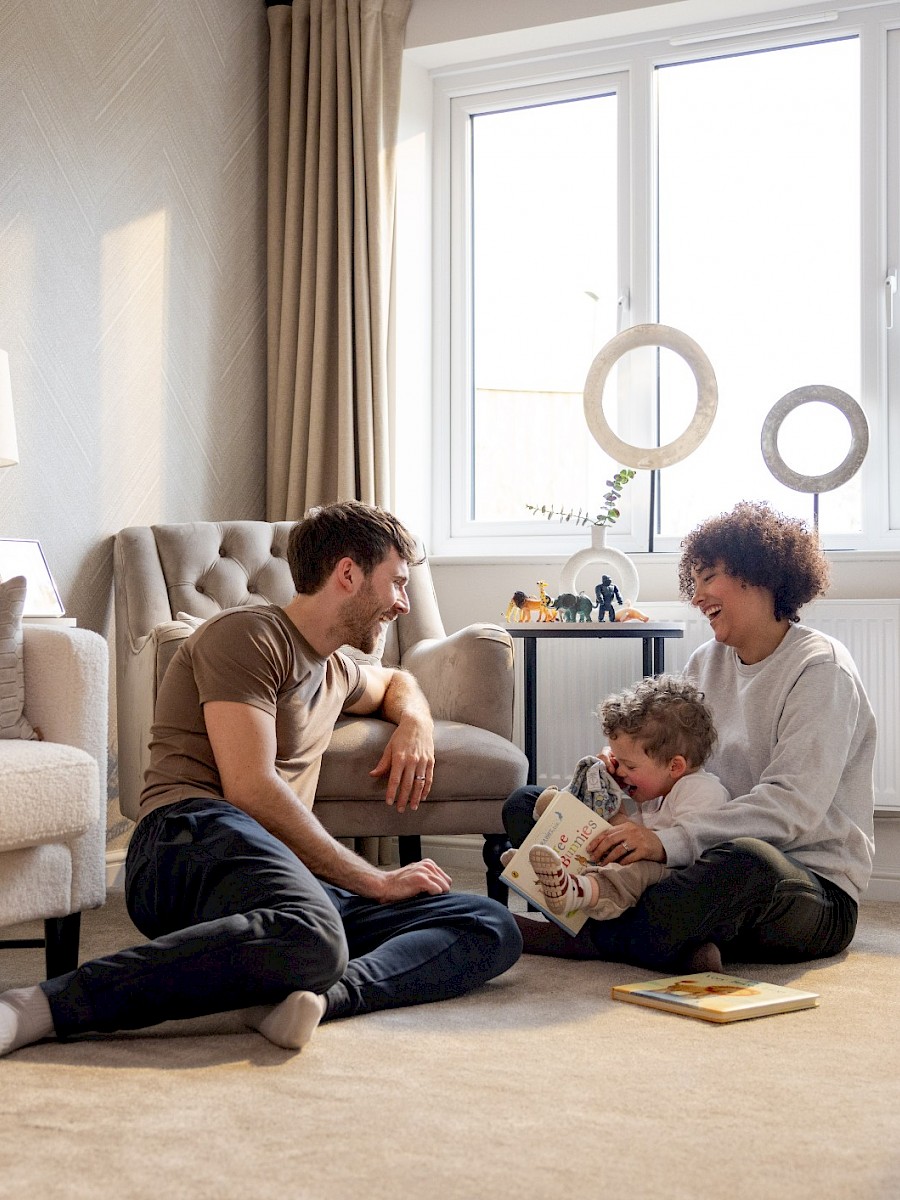 Happy family buyers in their living room
